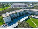 Aerial view of condo complex, showing building layout and parking at 5725 80Th N St # 116, St Petersburg, FL 33709