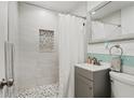 Clean bathroom with walk-in shower and pebble floor at 6327 2Nd S Ave, St Petersburg, FL 33707