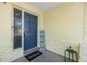 Inviting entryway with blue door and welcome mat at 11398 88Th Ave, Seminole, FL 33772