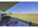 Patio overlooking a grassy area at 1318 Leland Dr, Sun City Center, FL 33573