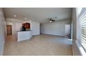 Open living room and kitchen area with tile floors at 1610 Bonita Bluff Ct, Ruskin, FL 33570