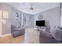 Bright living room with two sofas and a large TV at 1885 Greenwood Valley Dr, Plant City, FL 33563