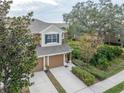 Two-story townhome with two-car garage and lush landscaping at 2044 Santa Catalina Ln Dr # 2044, Riverview, FL 33578