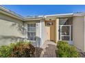 Inviting entryway with light colored walls and brick walkway at 2315 New Orchard Ct, Sun City Center, FL 33573
