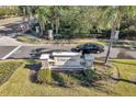 Community entrance sign with landscaping and a car driving by at 2517 Edgewater Falls Dr, Brandon, FL 33511