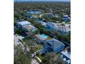 Blue house with a pool in a neighborhood setting at 4820 W San Jose St, Tampa, FL 33629