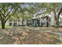 Community view with green space and building exteriors at 8517 Island Breeze Ln # 207, Temple Terrace, FL 33637