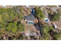 Aerial view showcasing the house, pool, and surrounding landscape at 12575 Maleo Rd, Weeki Wachee, FL 34614