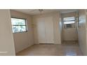 Bright bedroom with wood-look floors and double door closet at 1413 Lemon St, Clearwater, FL 33756