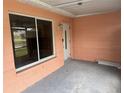 Covered porch with light fixture and entrance to the home at 1644 Connecticut Ne Ave, St Petersburg, FL 33703