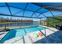 Relaxing pool area with screened enclosure and lake view at 20108 Sea Glass Cir, Land O Lakes, FL 34638