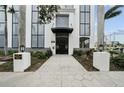 Modern building entrance with walkway and landscaping at 226 5Th N Ave # 1106, St Petersburg, FL 33701