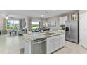 Modern kitchen with stainless steel appliances and granite countertops at 32722 Osprey Peak Way, San Antonio, FL 33576