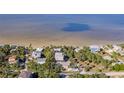 Aerial view showcasing waterfront property with a house and surrounding homes at 3478 Gum Dr, Weeki Wachee, FL 34607