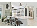 Modern kitchen with white quartz countertops and stainless steel appliances at 4316 Cairoli Ct, Wesley Chapel, FL 33543