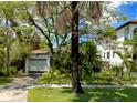 Single story home with white garage door and palm trees at 524 Suwanee Cir, Tampa, FL 33606