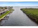 Aerial view of waterfront property with boat docks and lush vegetation at 8829 Bay Pointe Dr # 205, Tampa, FL 33615