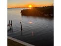Beautiful sunset view over the water from waterfront property at 8829 Bay Pointe Dr # 205, Tampa, FL 33615