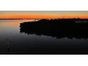 Stunning sunset over calm waters, showcasing the property's serene location at 8829 Bay Pointe Dr # 205, Tampa, FL 33615