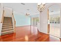 Bright dining room with hardwood floors and access to kitchen at 14545 Mirabelle Vista Cir, Tampa, FL 33626