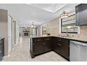 Spacious kitchen featuring dark cabinetry and granite countertops at 16013 Eagle River Way, Tampa, FL 33624