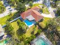 Aerial view showing home, pool, and large backyard at 2430 Roberta Ln, Clearwater, FL 33764