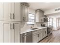 Modern kitchen featuring gray cabinets, quartz countertops, and stainless steel appliances at 3721 9Th S Ave, St Petersburg, FL 33711