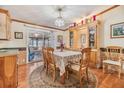 Charming dining area with wood table and built-in hutch at 37538 New Horizons Blvd, Zephyrhills, FL 33541