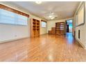 Spacious bedroom with wood flooring and built-in shelving at 4825 Sierra Madre Dr, Tampa, FL 33634