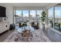 Bright living room with water views and comfortable seating at 507 Tamiami N Trl # 201, Venice, FL 34285