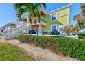 Two-story building with waterfront access and lush landscaping at 5116 Beach Se Dr # D, St Petersburg, FL 33705