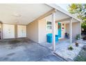 Attached garage with additional storage space and a covered walkway at 6350 22Nd N Ave, St Petersburg, FL 33710