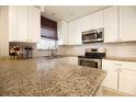 Renovated kitchen featuring granite countertops and stainless steel appliances at 6350 22Nd N Ave, St Petersburg, FL 33710