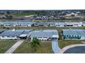Aerial view of a neighborhood with single Gathering homes at 1205 Chevy Chase Dr, Sun City Center, FL 33573