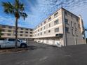Condo building with parking and tropical landscaping at 12500 Capri Cir N # 302, Treasure Island, FL 33706