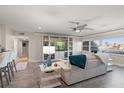 Living room with contemporary furniture and ocean view at 17400 Gulf Blvd # G2, Redington Shores, FL 33708