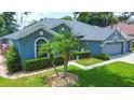 Spacious home with a well-manicured lawn and attractive facade at 2015 Wexford Green Dr, Valrico, FL 33594
