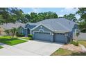 Stunning curb appeal with a well-maintained lawn and two-car garage at 2015 Wexford Green Dr, Valrico, FL 33594