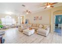 Spacious living room with large sectional sofa and tile floors at 2015 Wexford Green Dr, Valrico, FL 33594