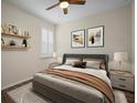 Spacious bedroom with a large bed, nightstands, and decorative artwork at 211 Shell Creek Ct, Apollo Beach, FL 33572