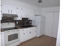 Bright kitchen, white cabinets, stone backsplash at 3201 Delaware W Ave, Plant City, FL 33563