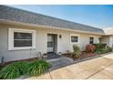 Condo entry with landscaping and walkway at 3521 Teeside Dr # 3521, New Port Richey, FL 34655