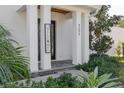 Inviting front porch with a welcoming sign and well-maintained landscaping at 4306 W Barcelona St, Tampa, FL 33629