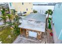 Detached garage with stone facade and ample parking space at 501 180Th E Ave, Redington Shores, FL 33708