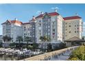 Luxury waterfront condo building with red tile roofs and boat slips at 700 S Harbour Island Blvd # 226, Tampa, FL 33602