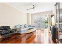 Bright living room with hardwood floors, sectional sofa, and large window at 700 S Harbour Island Blvd # 226, Tampa, FL 33602