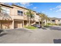 Townhouse exterior with parking and landscaping at 809 Normandy Trace Rd, Tampa, FL 33602