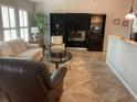 Spacious living room with fireplace and built-in shelving at 943 Columbia Ter, Port Charlotte, FL 33948