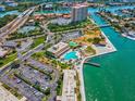 Aerial view showing community pool, tennis courts, and waterfront location at 5200 Brittany S Dr # 1204, St Petersburg, FL 33715