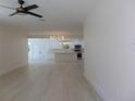 Bright and airy living room with light wood flooring at 10322 N Oakleaf Ave, Tampa, FL 33612